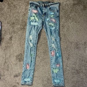 Super skinny jeans, size 32 with the green, pink and blue stitching